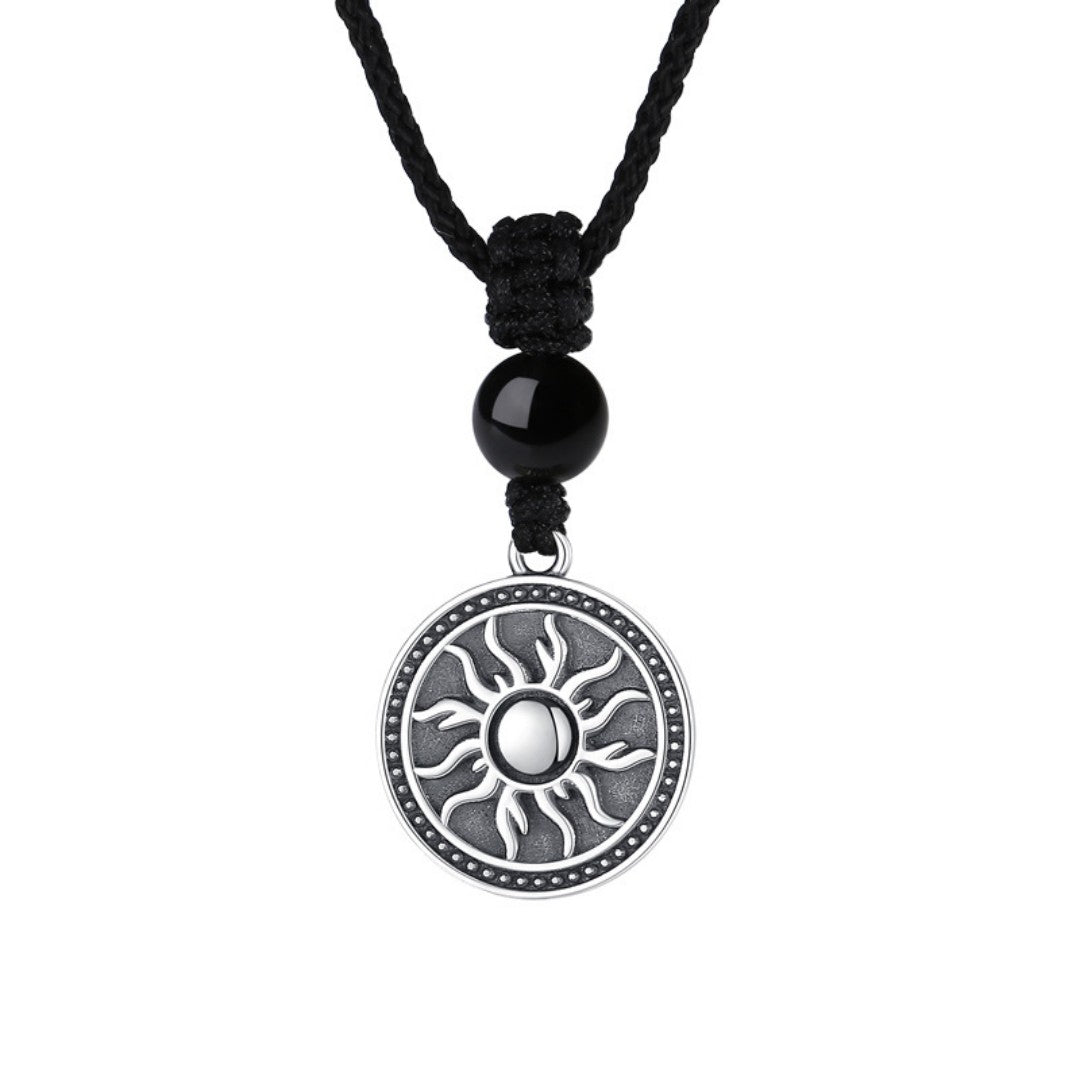 Sterling silver sun symbol pendant necklace with a black obsidian bead
