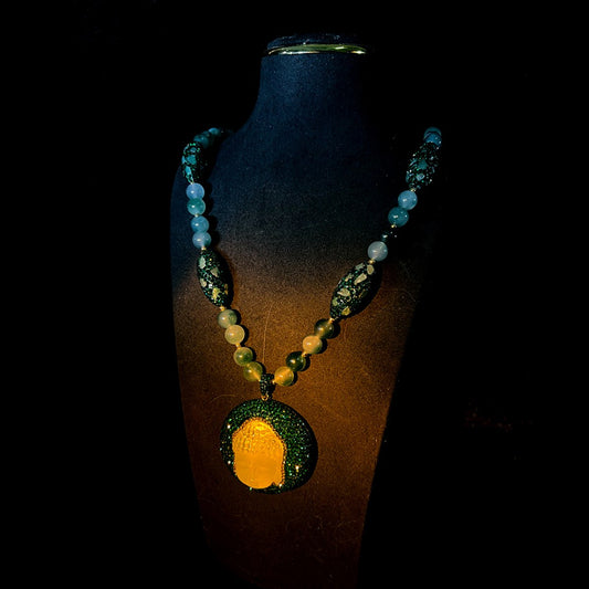 Multicolor bead necklace with translucent ivory Buddha head pendant