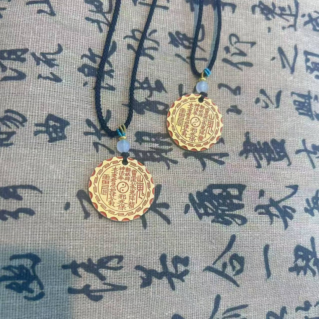 Model wearing brass Bagua pendant necklace — vintage Feng Shui jewelry