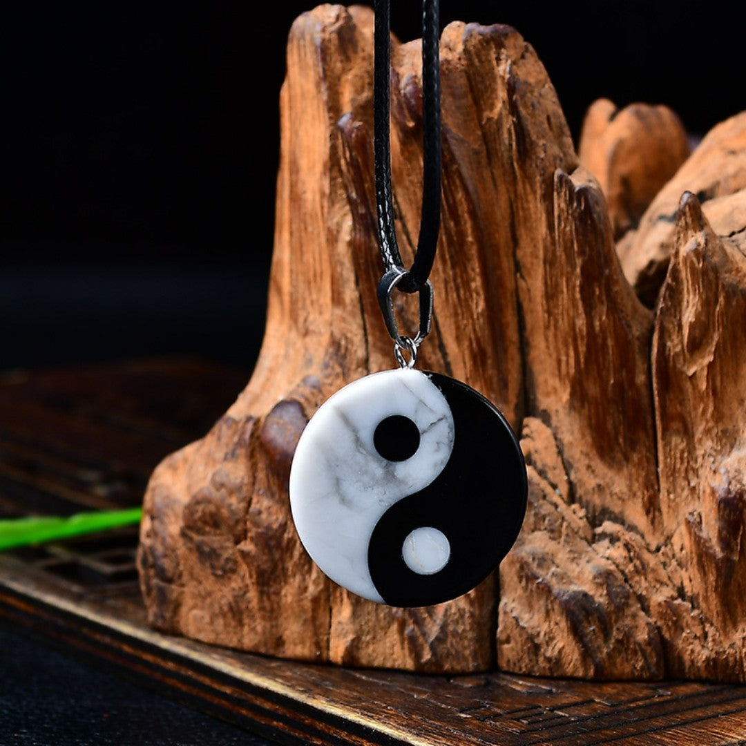 Yin Yang Bagua pendant necklace with white turquoise and black obsidian stones symbolizing balance and harmony