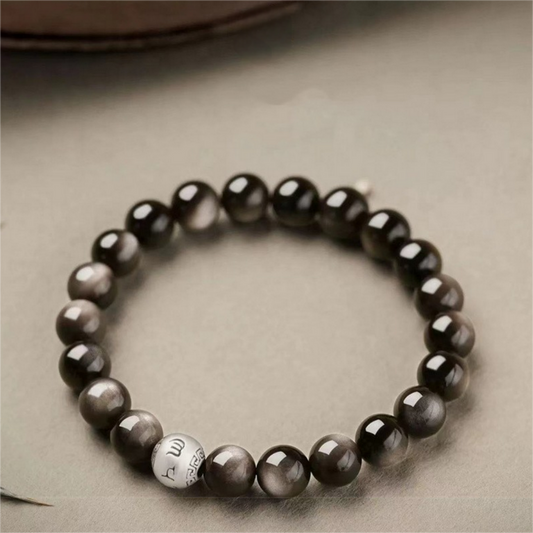 Silver obsidian bracelet with six-word mantra bead