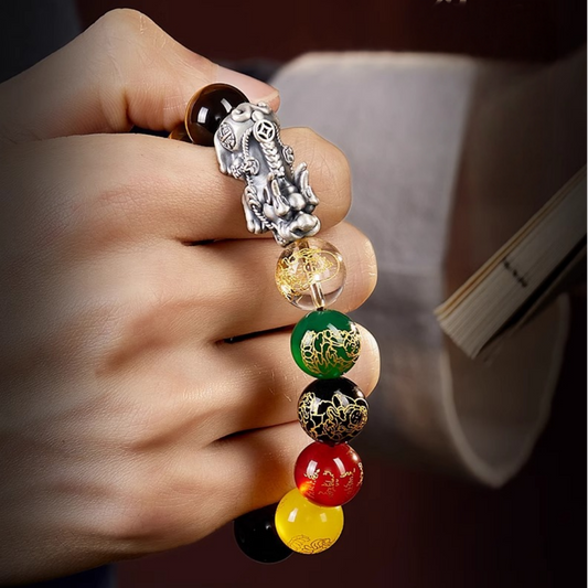 Brown Tiger’s Eye bead bracelet with five multicolor carved wealth god beads and a silver Pixiu charm