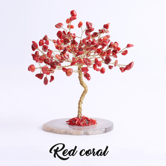 Coral crystal tree with copper wire branches on multicolored agate slice