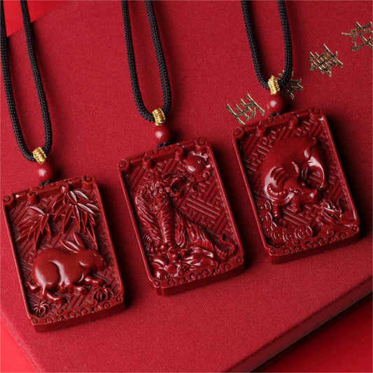 Cinnabar Chinese zodiac pendant necklace with carved zodiac animal and engraved character