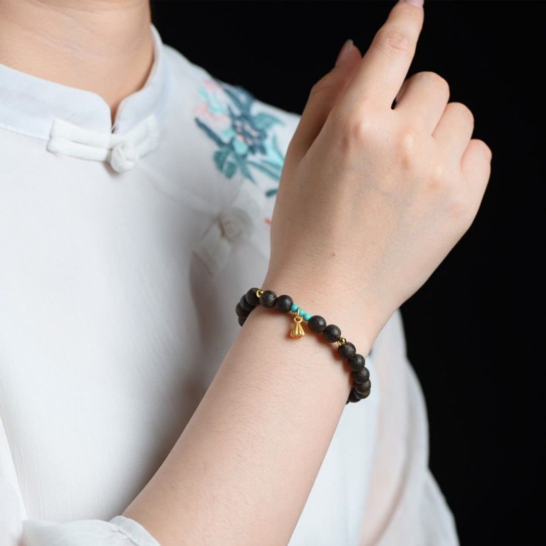 Agarwood and turquoise bead bracelet with lotus pod charm