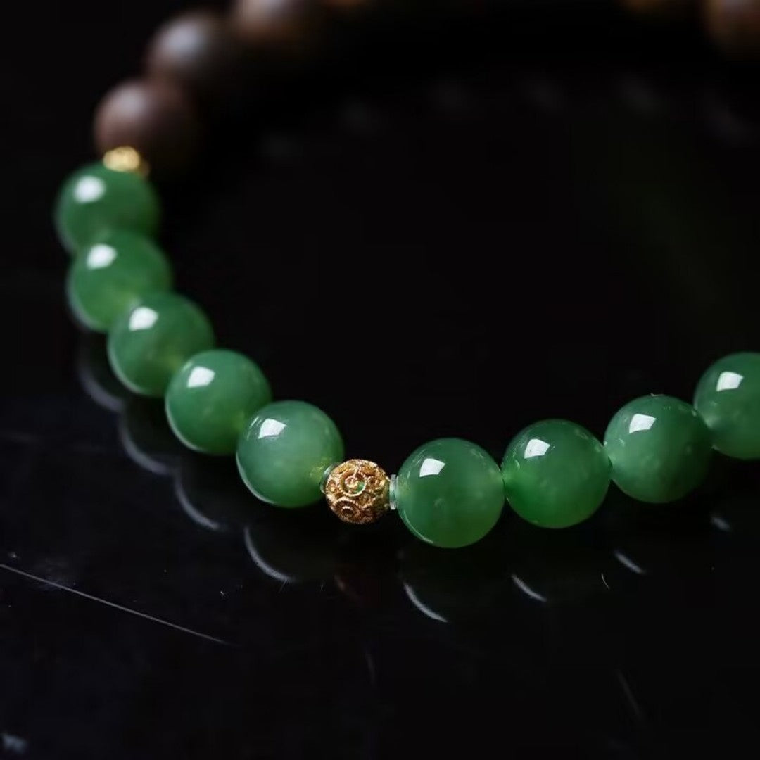 Hetian jade and agarwood bead bracelet with gold Fu charm