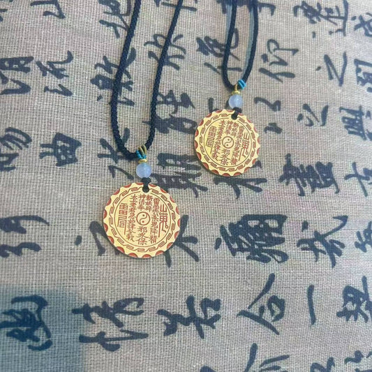 Model wearing brass Bagua pendant necklace — vintage Feng Shui jewelry