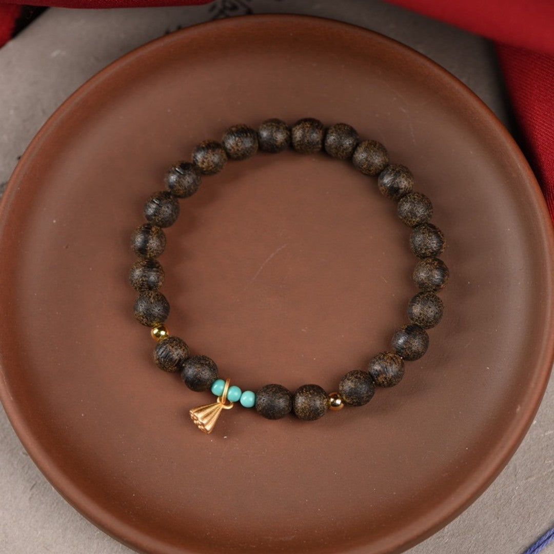 Agarwood and turquoise bead bracelet with lotus pod charm