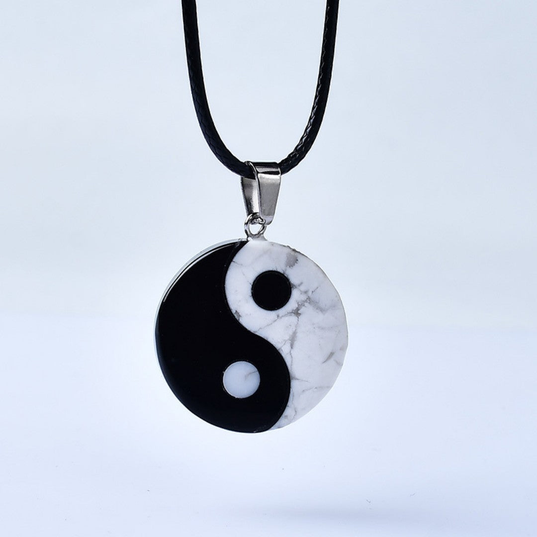 Yin Yang Bagua pendant necklace with white turquoise and black obsidian stones symbolizing balance and harmony