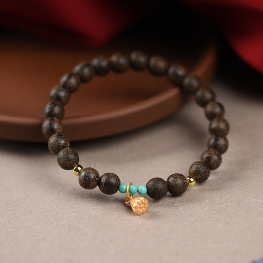 Agarwood and turquoise bead bracelet with lotus pod charm