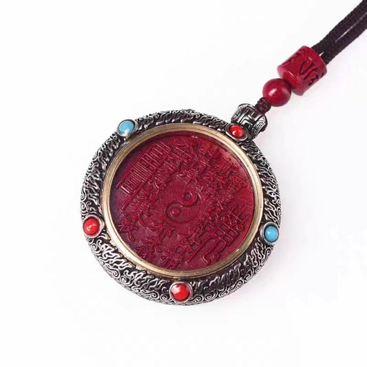 Natural cinnabar mountain spirit spinning amulet pendant with engraved Taoist symbol