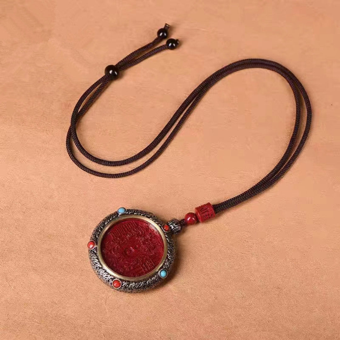 Natural cinnabar mountain spirit spinning amulet pendant with engraved Taoist symbol