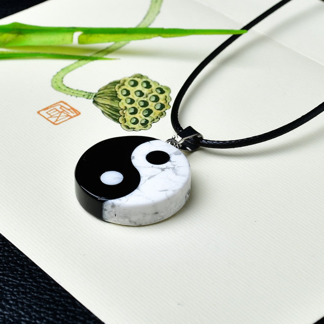 Yin Yang Bagua pendant necklace with white turquoise and black obsidian stones symbolizing balance and harmony