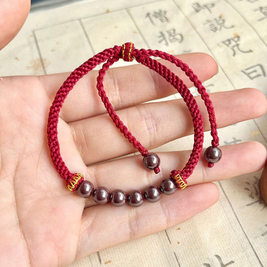 Handwoven cinnabar bracelet with adjustable cord