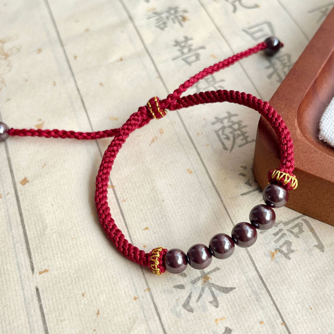 Handwoven cinnabar bracelet with adjustable cord