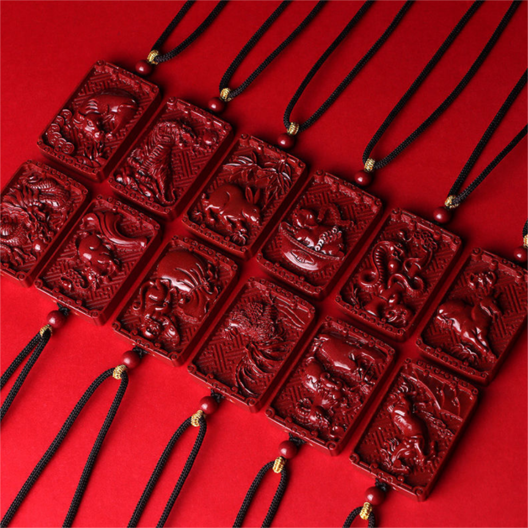 Cinnabar Chinese zodiac pendant necklace with carved zodiac animal and engraved character