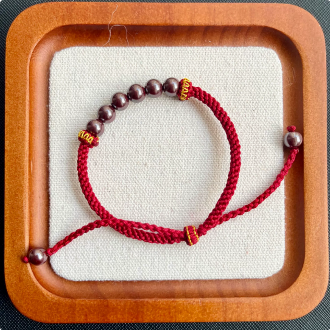 Handwoven cinnabar bracelet with adjustable cord