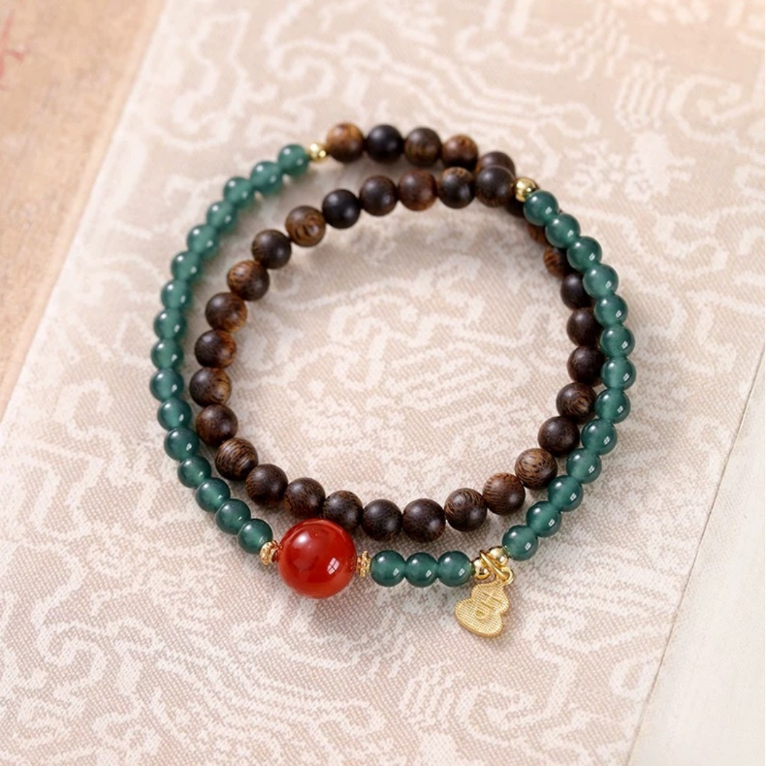 Blue jade and Qi-Nan agarwood dual-wrap bracelet with Ji charm