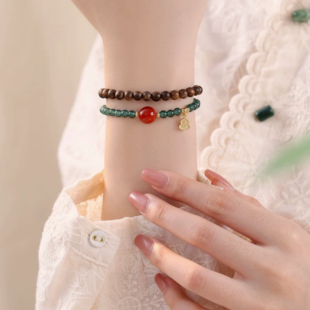 Blue jade and Qi-Nan agarwood dual-wrap bracelet with Ji charm