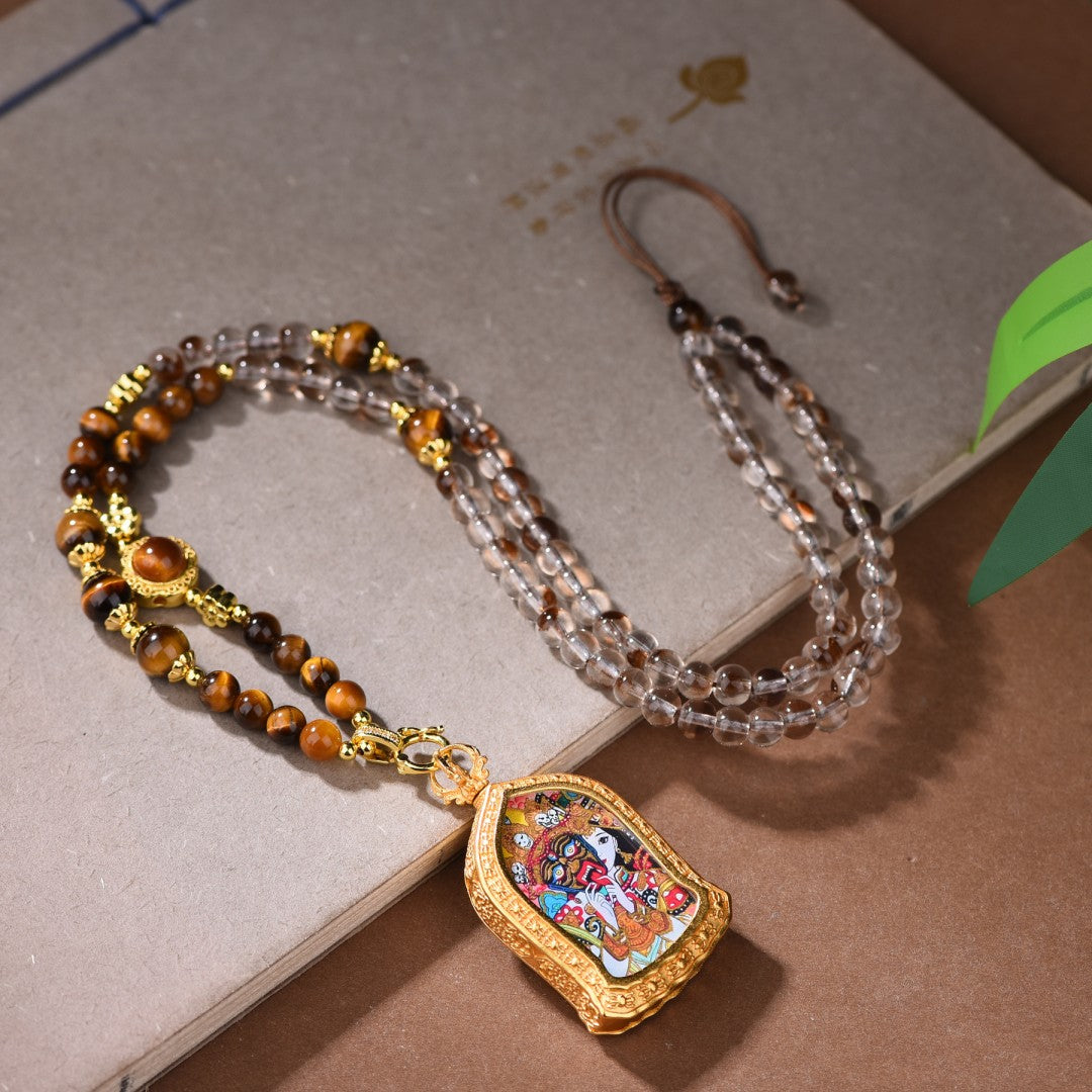 Clear quartz and tiger's eye necklace with Zakiram Tibetan Thangka pendant