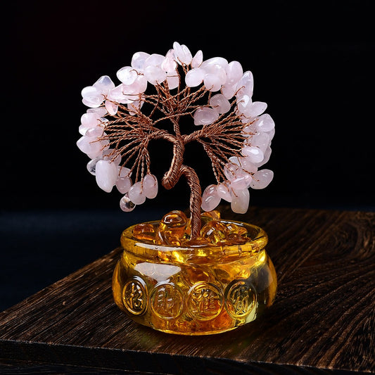 Rose quartz crystal tree with copper wire branches in golden resin pot filled with gold ingots
