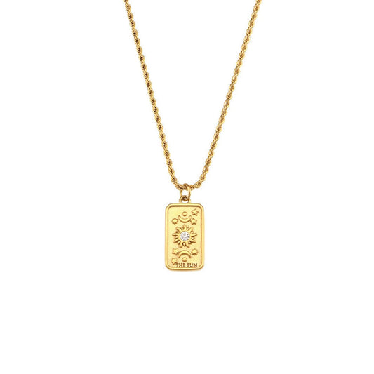 Gold talisman pendant necklace with a sun god motif